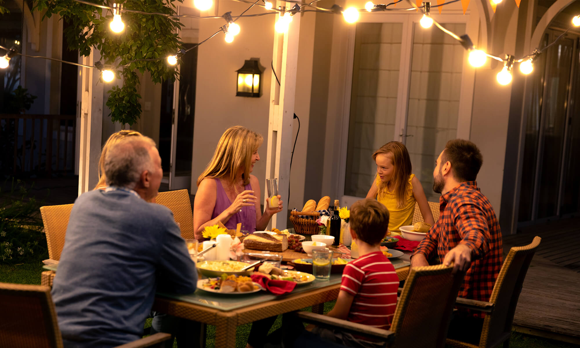 patio-lighting-with-family-bte